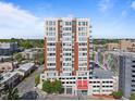 Stunning exterior of this contemporary condo building featuring red brick and many windows at 400 W North St # 1420, Raleigh, NC 27603