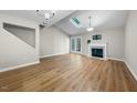 Bright living room with vaulted ceiling, fireplace, and access to the outdoor at 65 Forest Oaks Dr, Durham, NC 27705