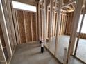 Bathroom with exposed framing and plumbing, showcasing layout and design for new construction home at 69 Tee Dr, Selma, NC 27576