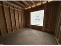 Bedroom with a window and exposed framing highlighting the room's size and natural light in the new construction home at 69 Tee Dr, Selma, NC 27576