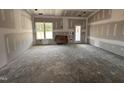 A sun-filled room featuring a large window providing bright, natural light and outdoor views at 69 Tee Dr, Selma, NC 27576