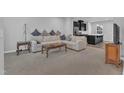 Spacious living room with plush carpeting, contemporary decor, and ample natural light at 8601 Red Canyon Way, Raleigh, NC 27616
