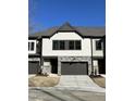 Townhome exterior with neutral siding, stone accents, attached garage, and well-kept front lawn at 964 Double Helix Rd, Apex, NC 27523