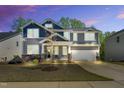 Beautiful two-story home featuring stone accents, neutral siding and a two car attached garage at 105 Scoville Rd, Garner, NC 27529