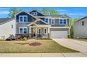 Beautiful two-story home with a two-car garage and manicured front yard at 105 Scoville Rd, Garner, NC 27529
