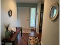 Welcoming entryway with unique decor and textured floors at 106 Orchard Rd, Henderson, NC 27536