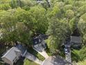 Aerial view of the home nestled among lush trees in a well-established neighborhood at 108 Ridgepath Way, Cary, NC 27511