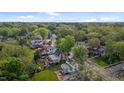 An aerial view showcases this home's location surrounded by lush greenery and a friendly neighborhood at 116 W Front St, Oxford, NC 27565