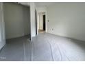 Neutral bedroom featuring a closet, base trim, and a view into the hallway at 12 Gates St, Roxboro, NC 27573