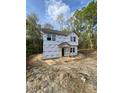 New construction shows the front of the home before siding and paint at 12 Gates St, Roxboro, NC 27573