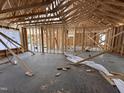 An inside view of the house's wooden frame during construction at 125 Tee Dr, Selma, NC 27576