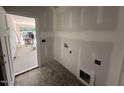 Under construction laundry room with ample space and natural light at 125 Tee Dr, Selma, NC 27576