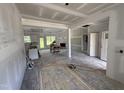Spacious living room under construction with a fireplace and lots of natural light at 125 Tee Dr, Selma, NC 27576