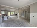 Bright open-concept living space with fireplace and access to the kitchen at 125 Tee Dr, Selma, NC 27576