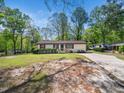 Single-story home with a lush front lawn and a long driveway to the side at 1301 Lynnwood Rd, Knightdale, NC 27545