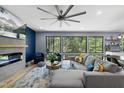 Inviting living room with a modern fireplace, comfortable seating, and scenic views from the large windows at 1401 Freshwater Ct, Wake Forest, NC 27587