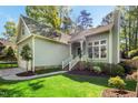 Inviting home exterior with manicured lawn and garden at 1433 Deltona Dr, Raleigh, NC 27615