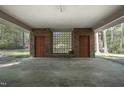 Large carport provides protected parking with red brick, two doors, and an attractive breeze block at 206 Rochelle Dr, Knightdale, NC 27545