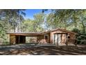 Well-maintained brick home featuring a covered carport and an inviting front porch at 206 Rochelle Dr, Knightdale, NC 27545