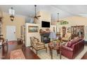 Spacious living room with beautiful floors, fireplace, and plenty of natural light at 227 Windlestraw, Pittsboro, NC 27312