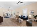 Bright, open-concept living room and dining area with neutral walls, hardwood floors, and stylish furnishings at 314 Bledsoe Ave, Raleigh, NC 27601