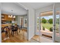 Welcoming entryway offering views of the dining room and well-manicured front yard, enhancing the home's appeal at 3646 Watkins Farm Rd, Hillsborough, NC 27278
