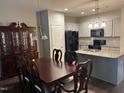 Open kitchen and dining area with an island, perfect for entertaining and Gathering meals at 48 Cullen Ct, Clayton, NC 27520