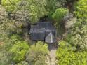 Aerial view of a house surrounded by green trees, providing privacy and a natural setting at 50 Beech Trl, Garner, NC 27529