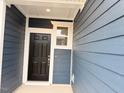 Inviting entryway with a modern front door and stylish exterior trim at 512 Eastwood St, Durham, NC 27704