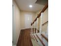 Traditional foyer with hardwood floors and carpeted stairs leading up to the second level at 5200 Lorbacher Rd, Apex, NC 27539