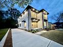 Stunning two-story home with stone and white siding, complemented by a spacious driveway at 622 Glascock St, Raleigh, NC 27604