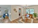 Open floor plan shows bright dining room, wood floors and living space at 775 Old Graham Rd, Pittsboro, NC 27312