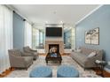 Cozy living room with fireplace, comfortable seating, and a stylish rug at 83 Calabria Ct, Clayton, NC 27527