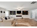 Spacious living room featuring an entertainment center and hardwood floors at 10 Shearin Ln, Youngsville, NC 27596