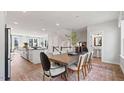 Open-concept dining room and kitchen featuring modern decor and stylish furniture at 10516 Pleasant Branch Dr # 34, Raleigh, NC 27614