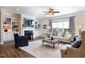 Cozy living room features a fireplace, built-in bookshelves, and plush seating at 1200 Gathering Park Cir # 302, Cary, NC 27519
