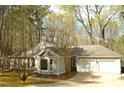 Well-maintained home featuring a side-entry garage, bay window, and mature trees at 12124 Warwickshire Park, Raleigh, NC 27613
