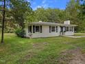 Exterior view of home featuring shuttered windows, an inviting front entrance, and bird bath at 1243 Nc 231, Wendell, NC 27591