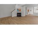 Living room featuring a fireplace and wood floors at 1640 Legendary Ln, Morrisville, NC 27560