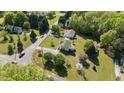 Aerial view of a house with expansive front and back yards in a lush green neighborhood at 20 Sanders Rd, Benson, NC 27504