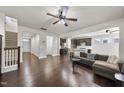 Spacious living room with hardwood floors, open to kitchen with modern finishes, and plenty of natural light at 204 Concordia Woods Dr, Morrisville, NC 27560