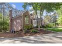 Beautiful brick house with arched windows and mature landscaping at 3928 White Chapel Way, Raleigh, NC 27615