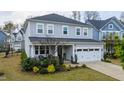 Charming two-story home with an attached two-car garage and front porch at 408 Torwood Cir, Apex, NC 27523