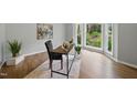 Bright and airy office with a bay window overlooking the lush greenery outside at 5610 Frenchmans Creek Dr, Durham, NC 27713