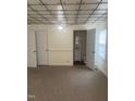Cozy room with carpet, adjacent to a bathroom, featuring classic wall and ceiling details at 610 W Old Rd, Lillington, NC 27546