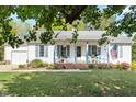 Inviting home with a cozy front porch, featuring classic details and a well-maintained lawn at 807 Clean View Ct, Fuquay Varina, NC 27526