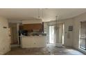 Spacious condo living room leading into the kitchen and featuring sliding glass doors at 811 New Kent Pl # 1A, Cary, NC 27511