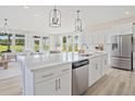 Bright, open kitchen with stainless steel appliances, a large island, and ample natural light at 1107 Shovelhead Dr # Homesite 39, Durham, NC 27703