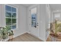 Bright foyer featuring stylish flooring, a large window, and a welcoming view of the front door at 1136 Remey Ave, Wake Forest, NC 27587