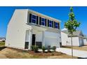Beautiful two-story home with a well-manicured lawn and a two-car garage at 133 N Keatts Winner Ct, Wilson's Mills, NC 27520